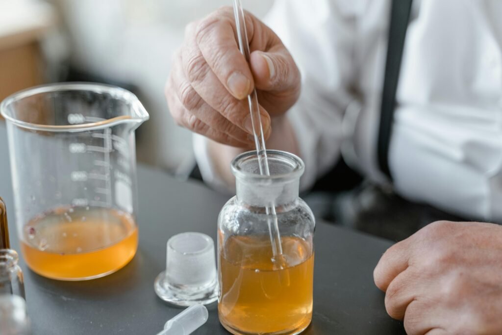 Detailed close-up of a scientific experiment involving liquid and glassware in a laboratory setting.